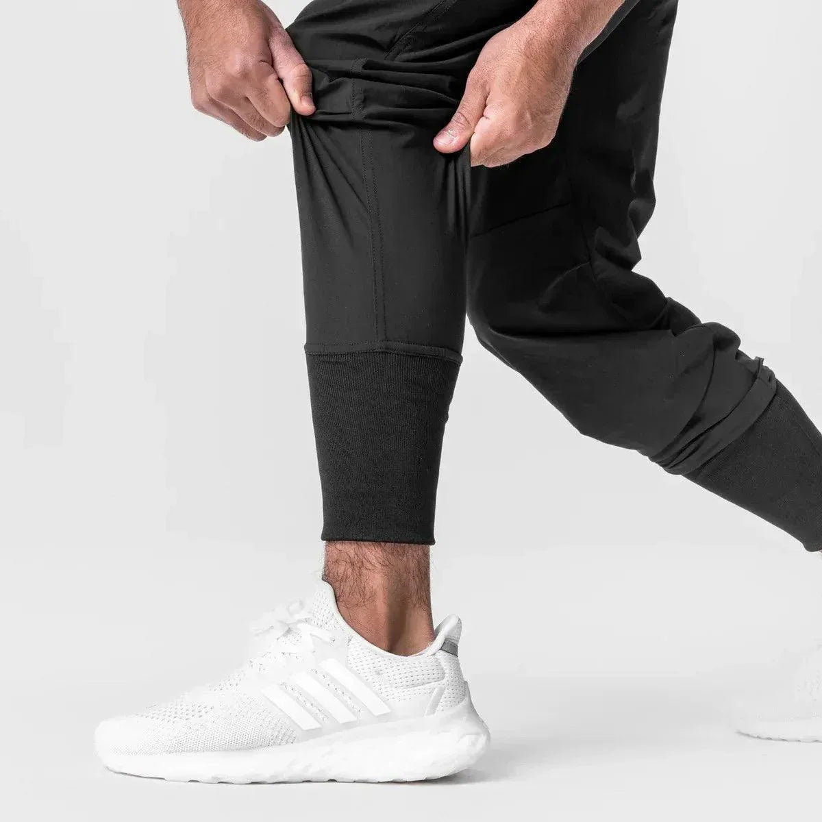 Calça Jogger Performance Titan™ com Suporte Inteligente para Toalha / Liberdade, Estilo e Funcionalidade em Uma Só Peça!